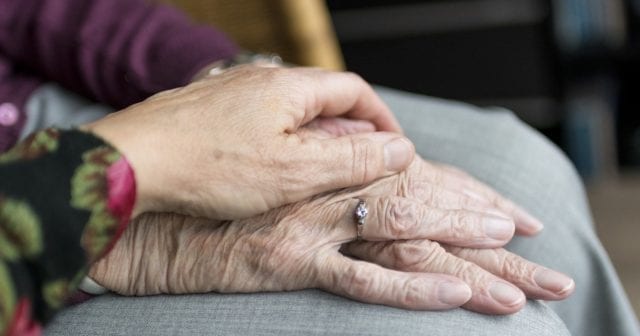 a woman caring for her aging mother