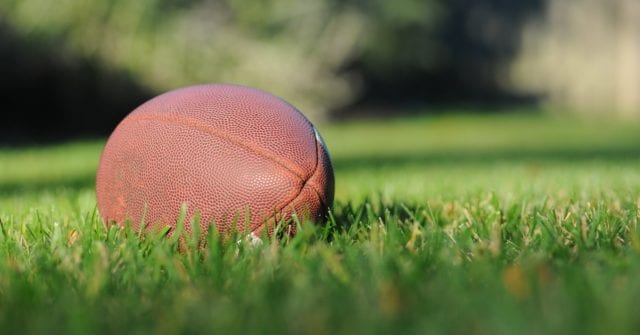 a football at a super bowl party