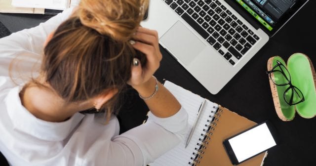 an identity theft victim looking frustrated because she doesn't have identity theft insurance