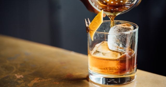 a bartender serving an appropriately sized drink to reduce their liquor liability risk