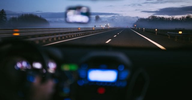 person driving a rental car wondering if they need rental car insurance