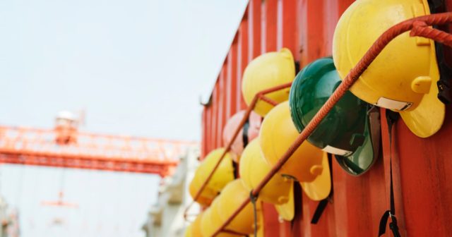 hard hats belonging to a company that follows workplace safety guidelines