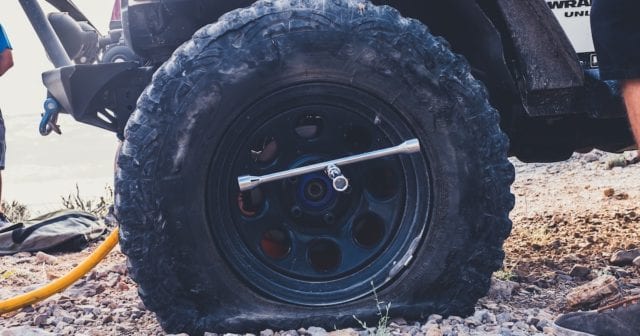 flat tire belonging to someone with an emergency kit in case of a breakdown