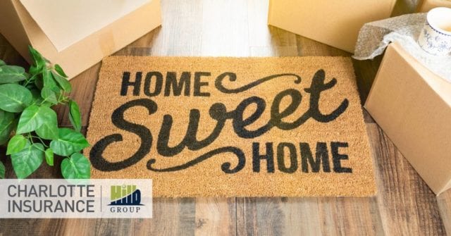 a "home sweet home" doormat in front of a home with a Charlotte home insurance policy