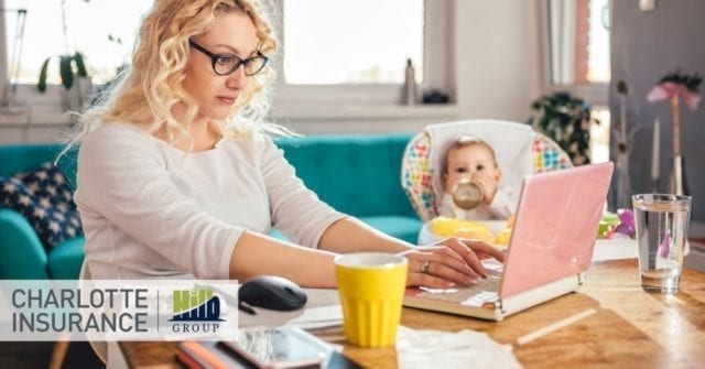 a woman working from home with a baby who could use some work from home tips