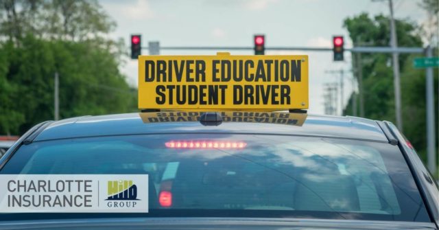 a car with a student driver sign on the top being drive by a young driver