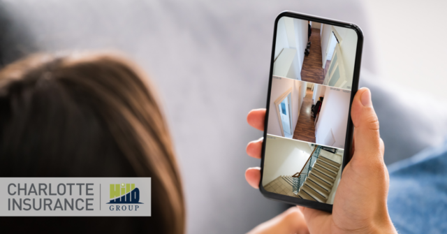 a homeowner checking their home security system on their phone.