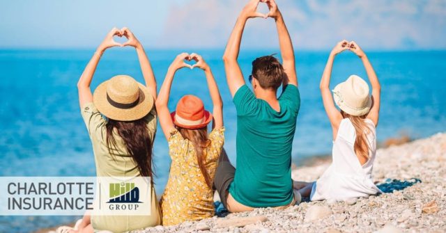 a family relaxing on the beach during their vacation because they know what their homeowners insurance does and does not cover