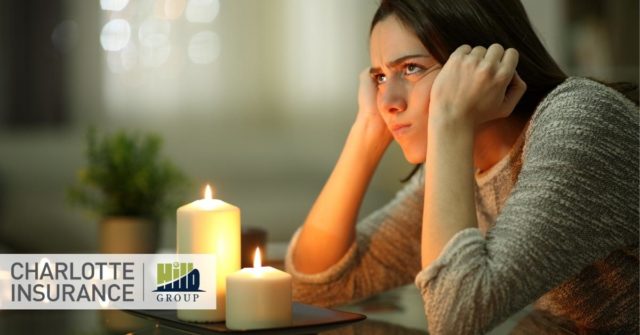 someone in an apartment during a power outage with renters insurance