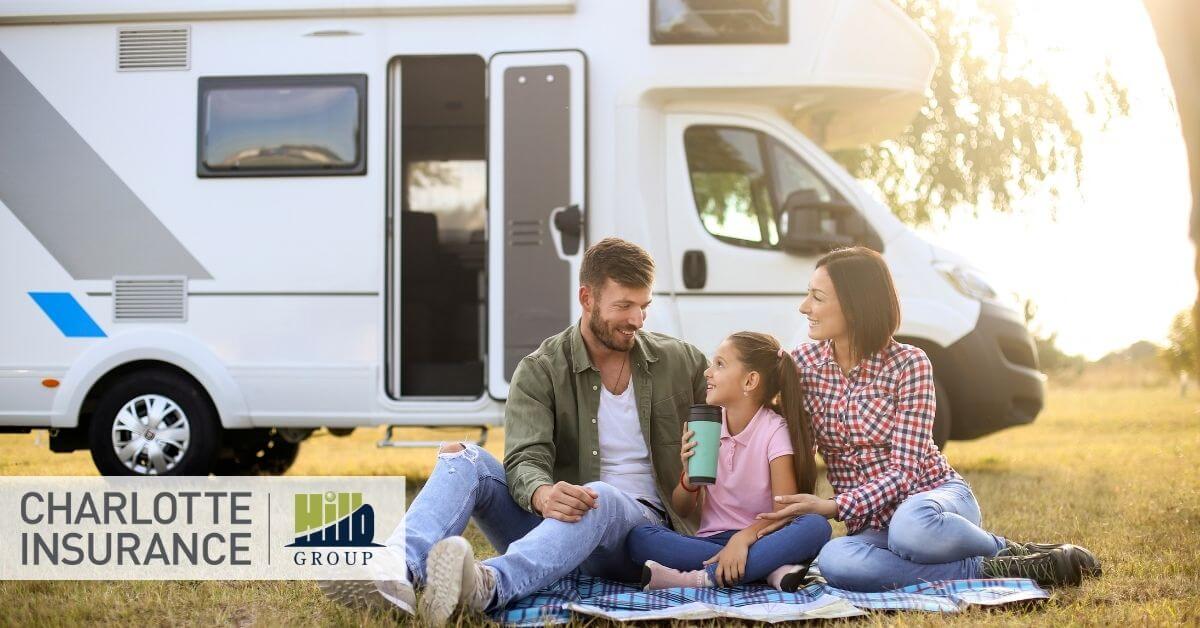 a family relaxing outside of their RV knowing that they have a great RV insurance policy