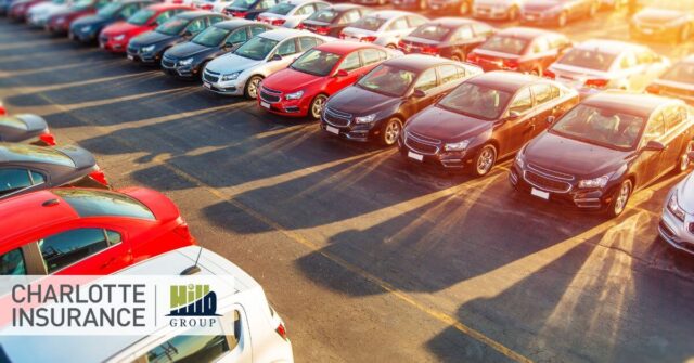 a fleet of vehicles at an auto dealership in need of fleet insurance