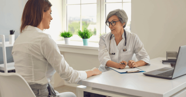 a nurse at an in-house pharmacy clinic discussing their insurance with their insurance agent
