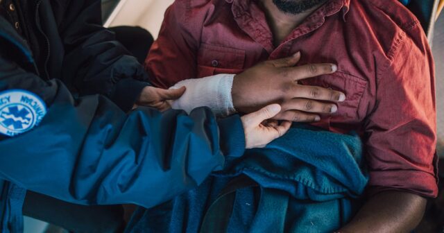 an EMT with a solid understanding of HIPAA requirements helping a patient. httpswww.pexels.comphotoperson-helping-a-man-place-his-arm-on-chest-6520100