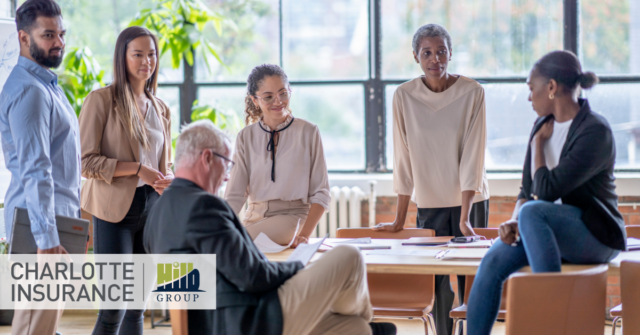 a group of business problems discussing their New Year insurance needs